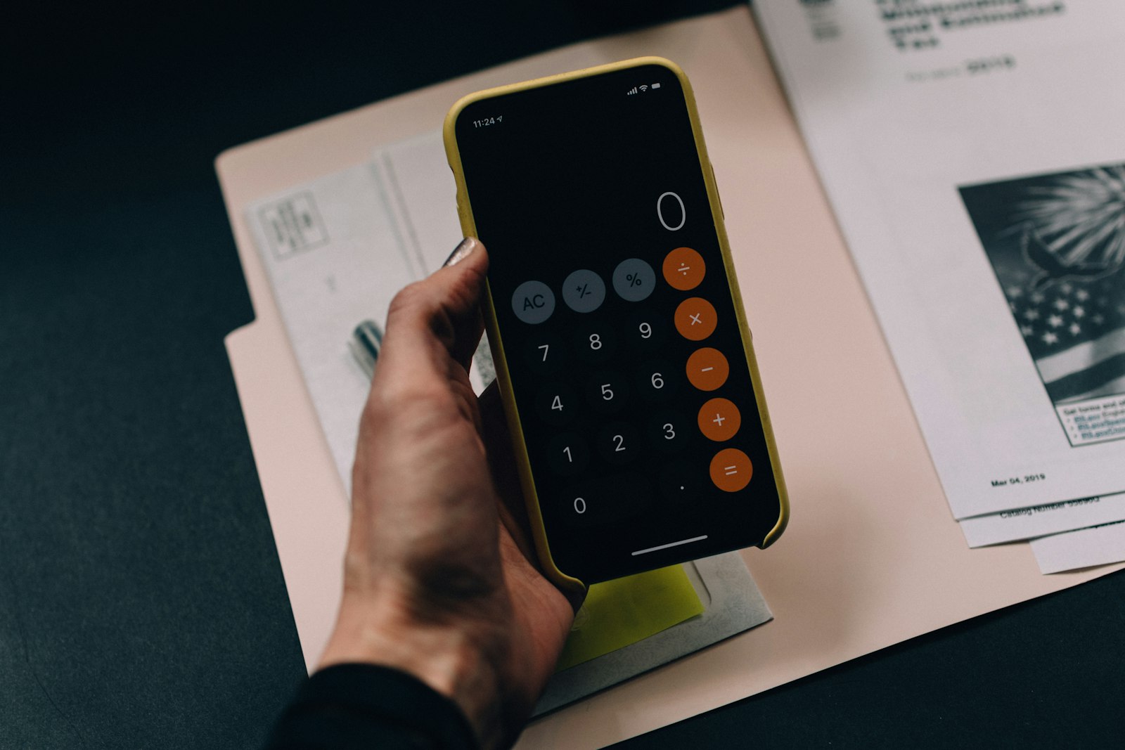 Calculator and financial documents on a desk
