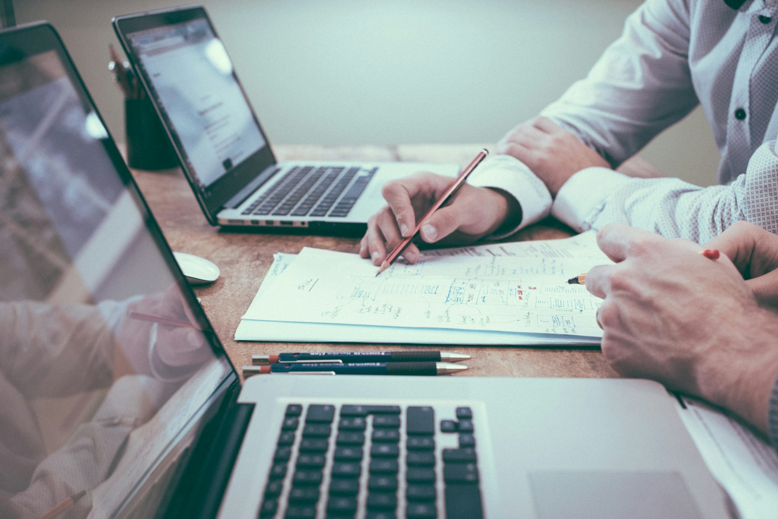 Professionals reviewing financial plans and documents